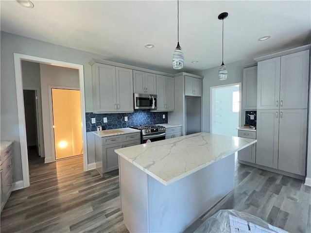 154 Pope Paul Path, Dallas, GA 30132 - kitchen featuring gray cabinets, appliances with stainless steel finishes, backsplash, and dark wood-style floors