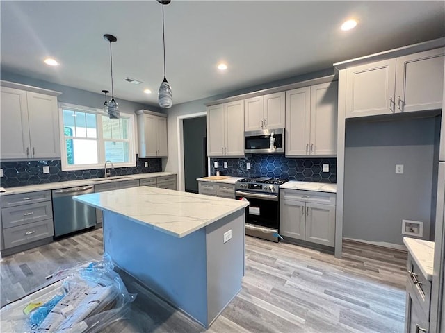 154 Pope Paul Path, Dallas, GA 30132 - kitchen with a sink, gray cabinets, tasteful backsplash, and stainless steel appliances