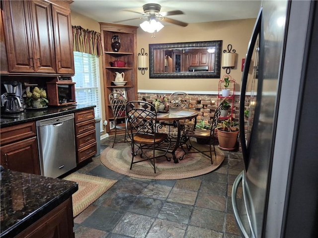 4094 Carlisle Pl, Stone Mountain, GA 30083 - kitchen featuring stainless steel appliances, a ceiling fan, open shelves, and dark stone finish flooring