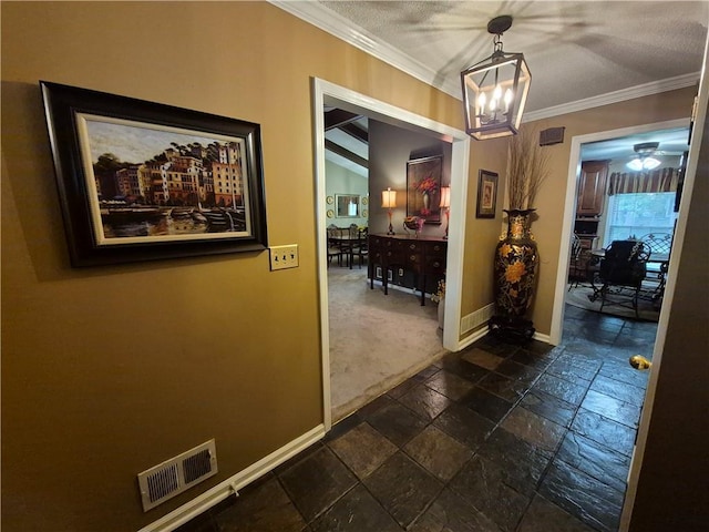 4094 Carlisle Pl, Stone Mountain, GA 30083 - corridor with stone tile flooring, a chandelier, ornamental molding, and dark colored carpet
