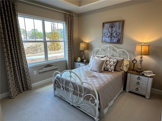 carpeted bedroom featuring baseboards