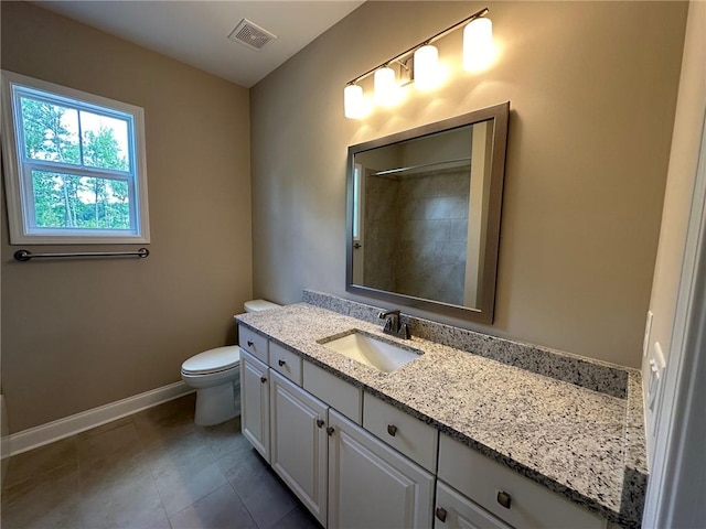 bathroom with vanity, toilet, baseboards, a shower, and visible vents