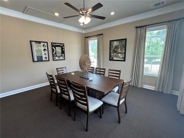 dining space with baseboards, visible vents, ceiling fan, and attic access