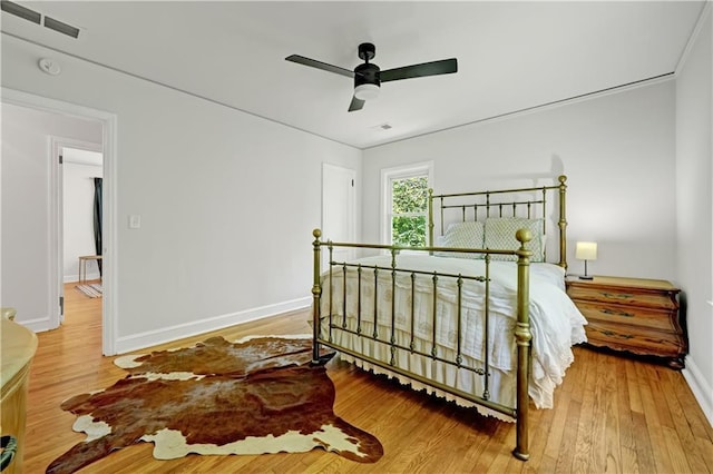 1544 Brewer Blvd SW, Atlanta, GA 30310 - bedroom with wood finished floors, baseboards, and a ceiling fan