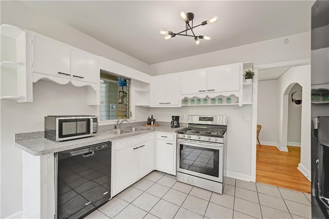 1544 Brewer Blvd SW, Atlanta, GA 30310 - kitchen with open shelves, stainless steel appliances, a sink, and white cabinetry