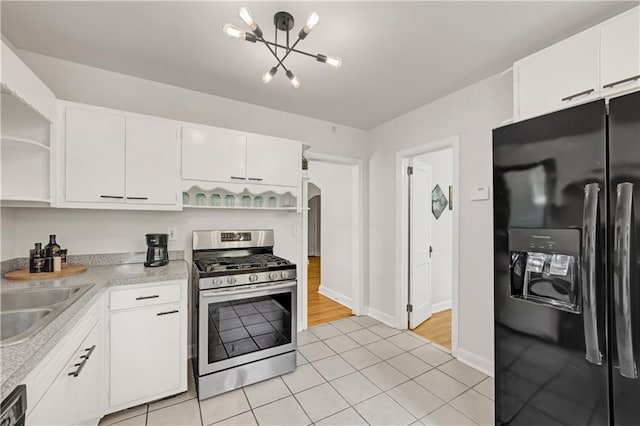 1544 Brewer Blvd SW, Atlanta, GA 30310 - kitchen featuring black fridge with ice dispenser, open shelves, stainless steel range with gas cooktop, a sink, and light countertops