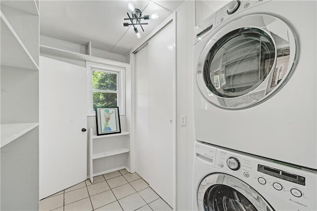 1544 Brewer Blvd SW, Atlanta, GA 30310 - washroom featuring stacked washing machine and dryer and light tile patterned flooring