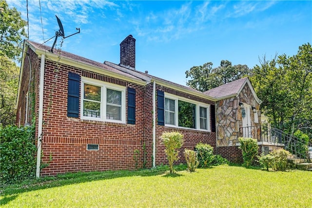 1544 Brewer Blvd SW, Atlanta, GA 30310 - view of side of property featuring a chimney, brick siding, and a lawn