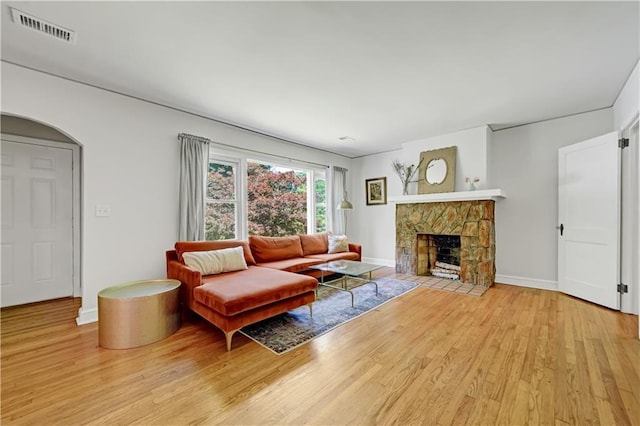1544 Brewer Blvd SW, Atlanta, GA 30310 - living area with wood finished floors, a fireplace, and baseboards