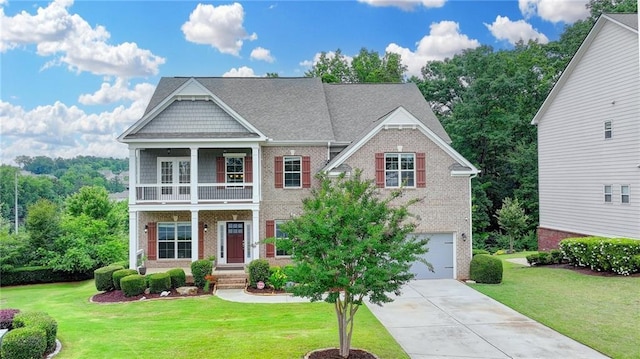 5770 Bridleton Xing, Suwanee, GA 30024 - view of front of property with brick siding, a balcony, concrete driveway, an attached garage, and a front lawn