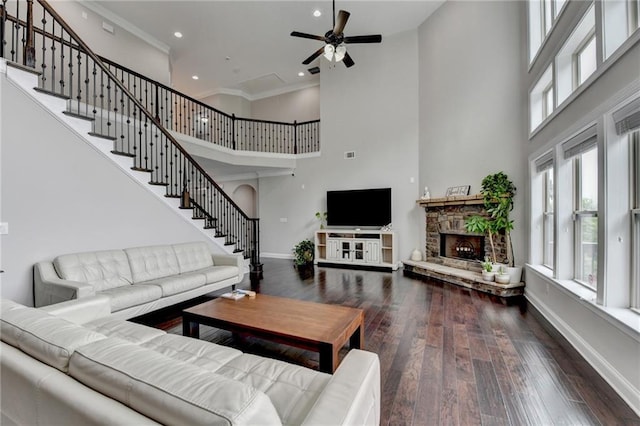 5770 Bridleton Xing, Suwanee, GA 30024 - living area with a towering ceiling, healthy amount of natural light, baseboards, ceiling fan, and wood finished floors
