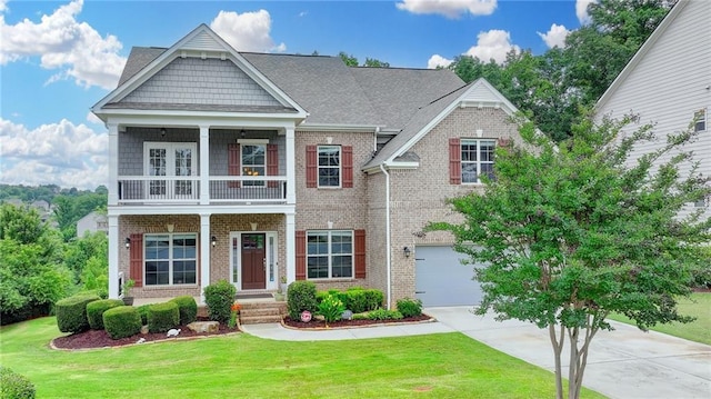 5770 Bridleton Xing, Suwanee, GA 30024 - craftsman-style home featuring a balcony, concrete driveway, a front yard, and brick siding