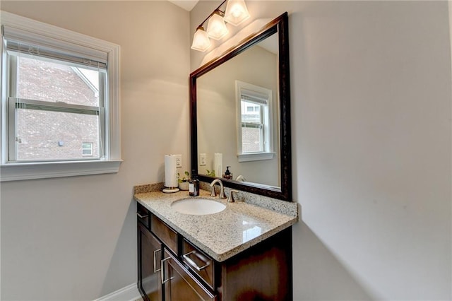 5770 Bridleton Xing, Suwanee, GA 30024 - bathroom featuring vanity, healthy amount of natural light, and baseboards