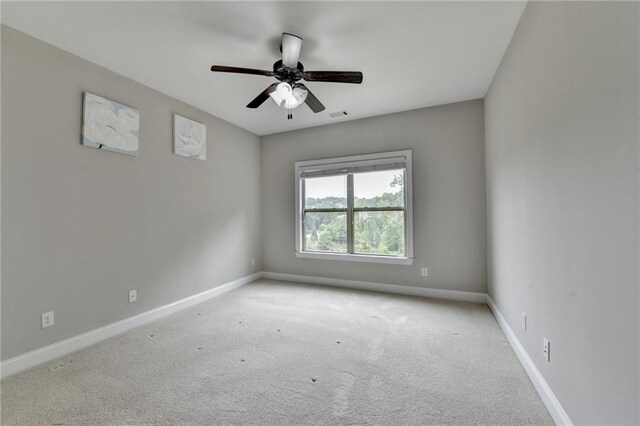 5770 Bridleton Xing, Suwanee, GA 30024 - unfurnished room featuring baseboards, carpet, and a ceiling fan