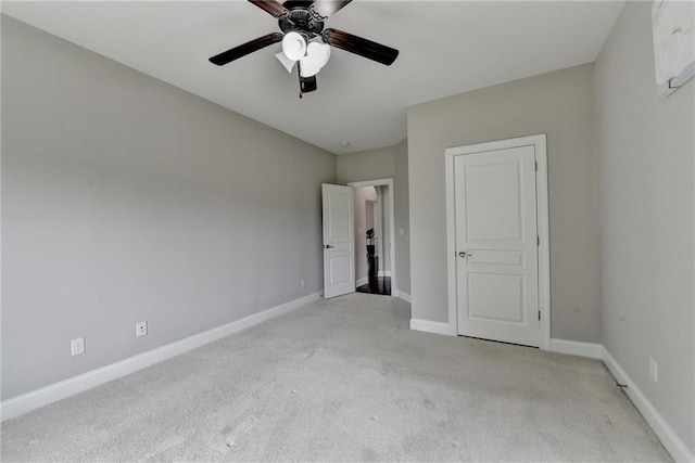 5770 Bridleton Xing, Suwanee, GA 30024 - unfurnished bedroom featuring carpet flooring, baseboards, and a ceiling fan