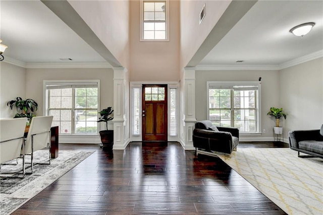 5770 Bridleton Xing, Suwanee, GA 30024 - foyer with decorative columns, healthy amount of natural light, wood-type flooring, and ornamental molding