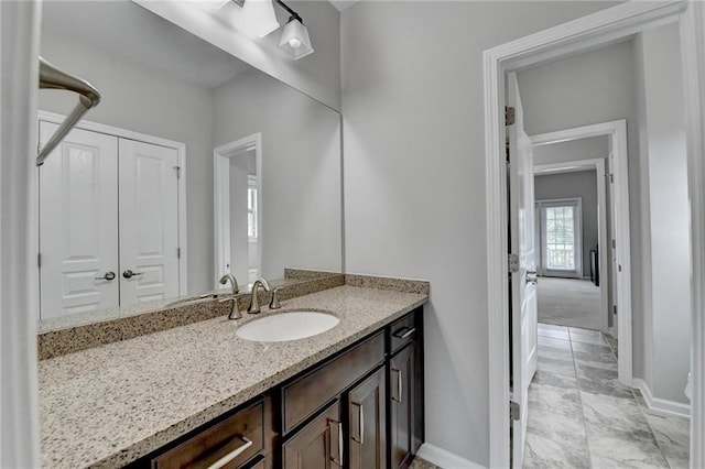 5770 Bridleton Xing, Suwanee, GA 30024 - bathroom with baseboards and vanity