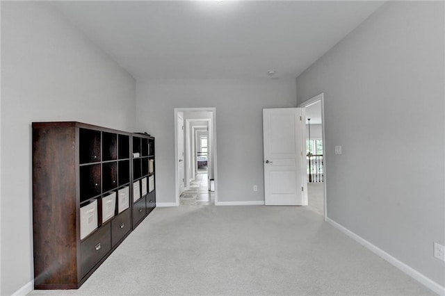 5770 Bridleton Xing, Suwanee, GA 30024 - unfurnished bedroom featuring multiple windows, baseboards, and carpet floors