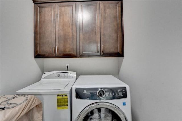 5770 Bridleton Xing, Suwanee, GA 30024 - laundry area with washer and clothes dryer and cabinet space