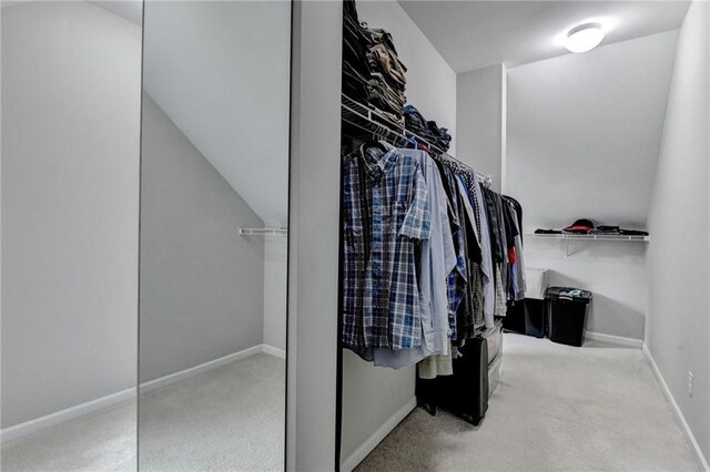 5770 Bridleton Xing, Suwanee, GA 30024 - walk in closet featuring carpet floors
