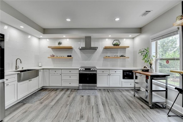 5770 Bridleton Xing, Suwanee, GA 30024 - kitchen featuring stainless steel electric range oven, a sink, wall chimney exhaust hood, open shelves, and recessed lighting