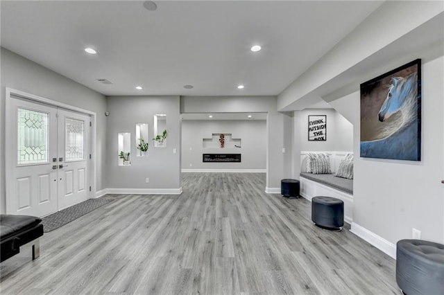 5770 Bridleton Xing, Suwanee, GA 30024 - entryway with light wood finished floors, recessed lighting, baseboards, and french doors