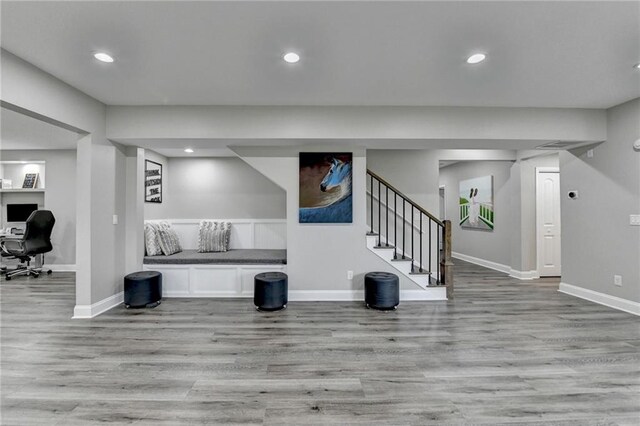 5770 Bridleton Xing, Suwanee, GA 30024 - basement featuring wood finished floors, baseboards, stairs, a desk, and recessed lighting