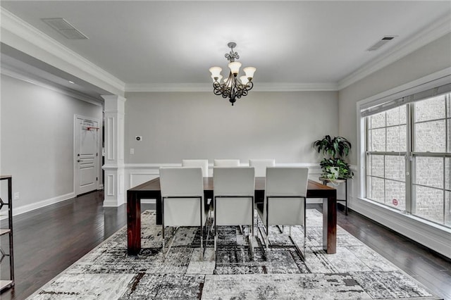 5770 Bridleton Xing, Suwanee, GA 30024 - dining space with a chandelier, decorative columns, dark wood-style flooring, and ornamental molding