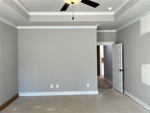 empty room with concrete flooring and baseboards