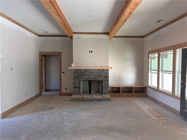 unfurnished living room featuring beam ceiling, a fireplace, visible vents, and baseboards