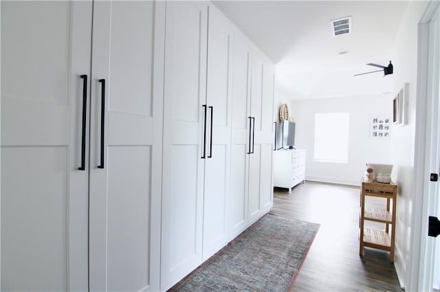 dining area featuring baseboards, healthy amount of natural light, and dark wood-style flooring