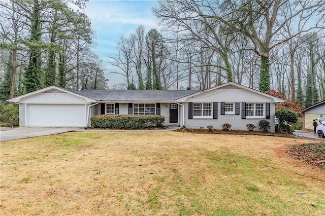 ranch-style house with crawl space, brick siding, concrete driveway, a front lawn, and an attached garage