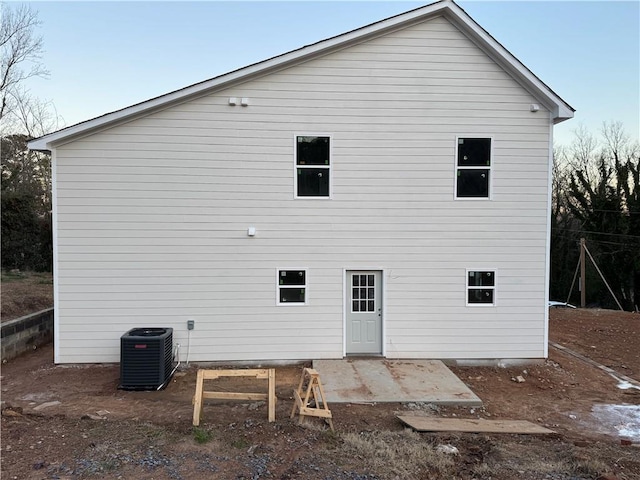 back of house featuring central air condition unit and a patio