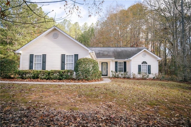 ranch-style house with a front lawn