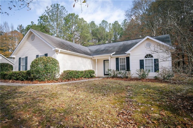 single story home featuring a front lawn