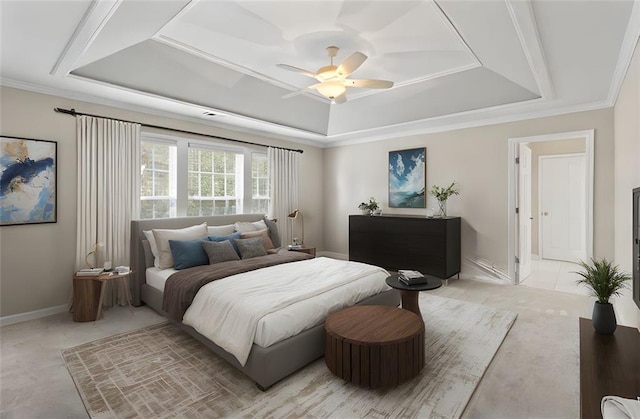 bedroom featuring ornamental molding and a raised ceiling