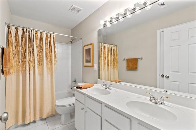 bathroom featuring a sink, visible vents, and tile patterned floors