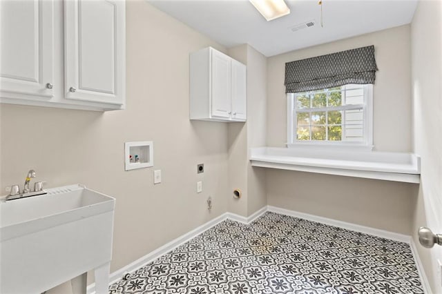 laundry area with hookup for a washing machine, hookup for an electric dryer, a sink, baseboards, and cabinet space