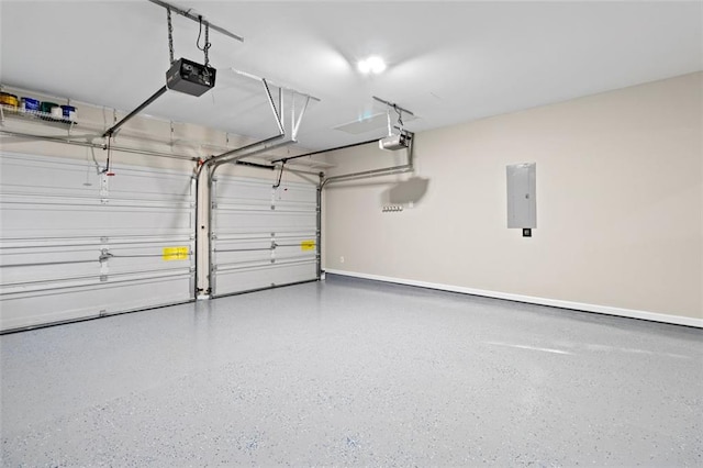 garage with electric panel, baseboards, and a garage door opener