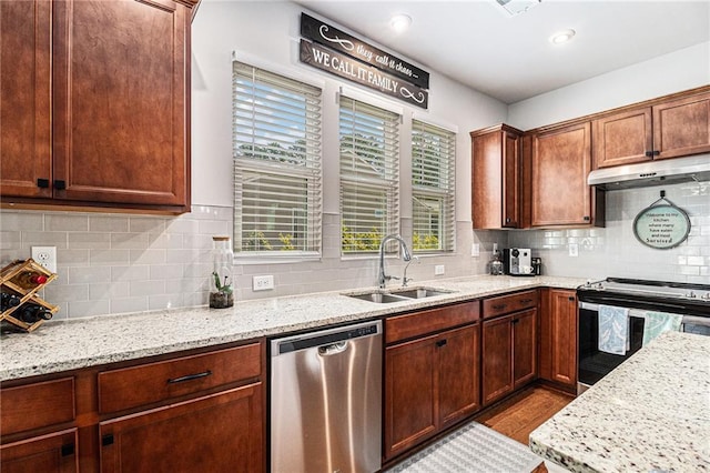 1000 Eight Knot Ct, Greensboro, GA 30642 - kitchen featuring appliances with stainless steel finishes, a sink, under cabinet range hood, decorative backsplash, and light stone countertops
