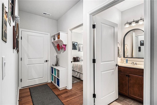 1000 Eight Knot Ct, Greensboro, GA 30642 - mudroom with dark wood finished floors and a sink