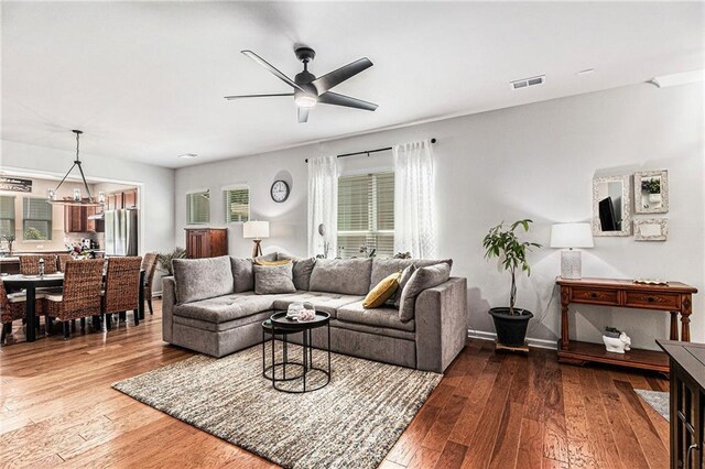 1000 Eight Knot Ct, Greensboro, GA 30642 - living area with wood-type flooring, ceiling fan, and baseboards