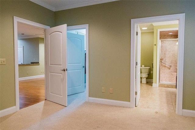 105 Maplecrest Ln, Rome, GA 30161 - unfurnished bedroom featuring crown molding, carpet floors, a spacious closet, connected bathroom, and a closet