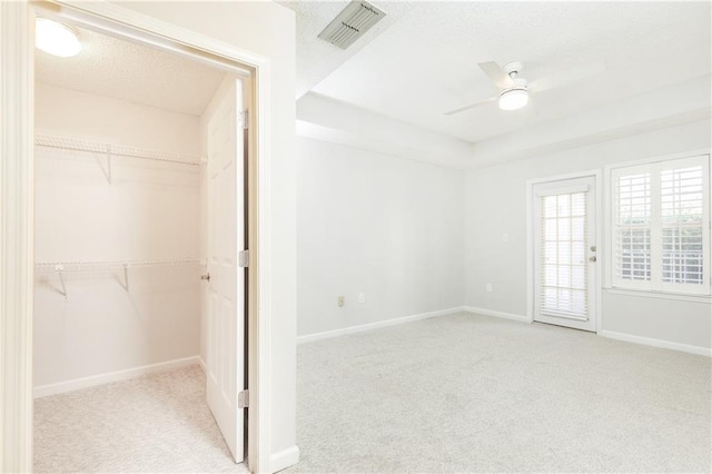 220 Renaissance Pkwy NE Unit 1105, Atlanta, GA 30308 - unfurnished bedroom with carpet floors, a closet, a textured ceiling, ceiling fan, and access to exterior