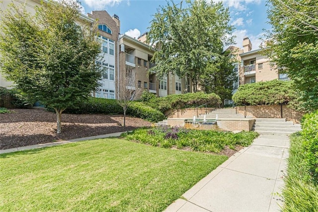 220 Renaissance Pkwy NE Unit 1105, Atlanta, GA 30308 - view of community featuring a lawn
