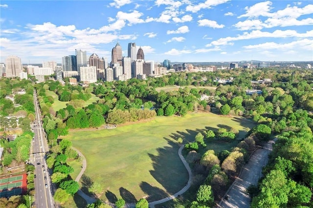 220 Renaissance Pkwy NE Unit 1105, Atlanta, GA 30308 - aerial view of property's location featuring city skyline and a tree filled landscape