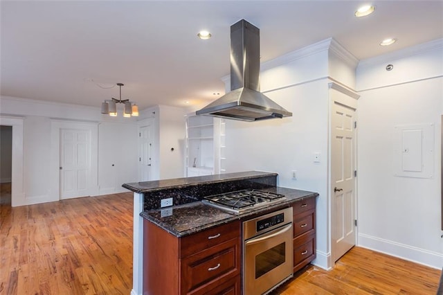 kitchen featuring dark stone countertops, stainless steel appliances, island exhaust hood, and light wood-type flooring