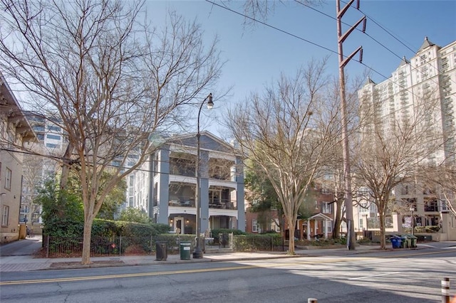 view of building exterior with fence