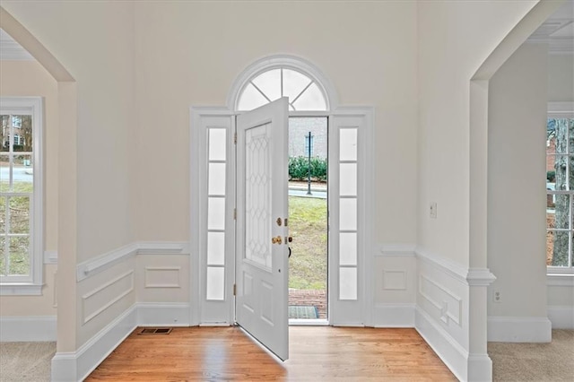 foyer entrance with light wood-type flooring