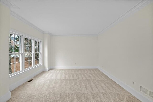 unfurnished room with light colored carpet and ornamental molding